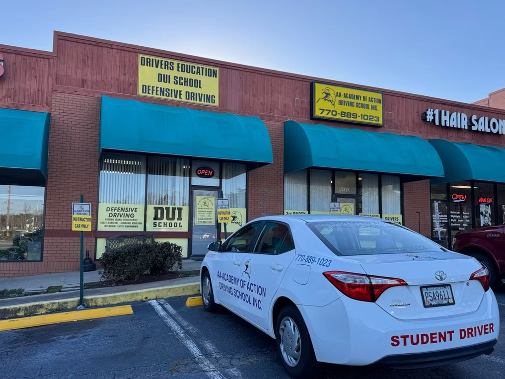 AA Academy Driving School exterior with student car